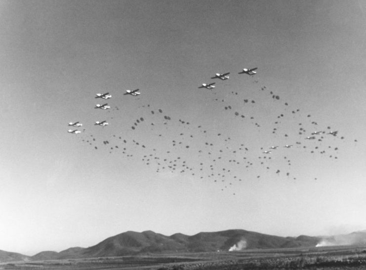 U.S. Army paratroopers of the 187th Regimental Combat Team jump out of U.S. Air Force C-119 Flying Boxcars of the 403rd Troop Carrier Wing during a maneuver near Taegu, Korea, on 1 November 1952.