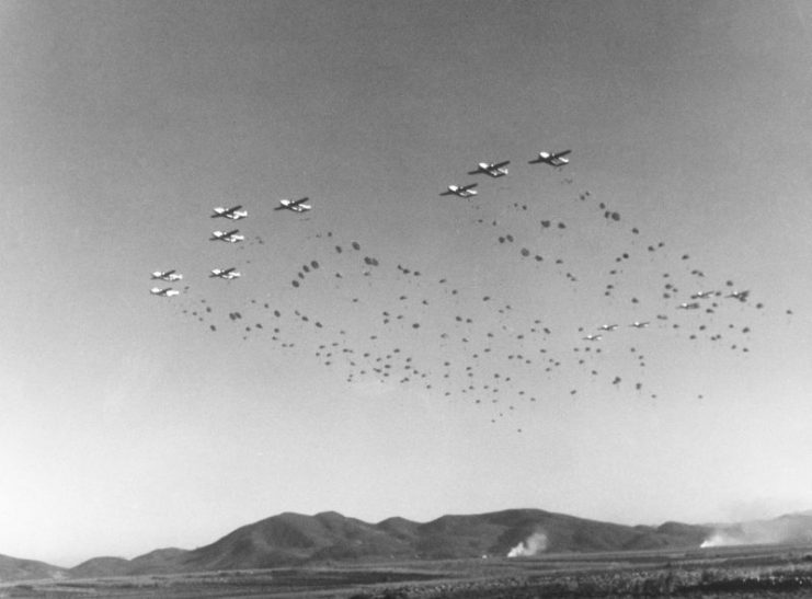 U.S. Army paratroopers of the 187th Regimental Combat Team jump out of U.S. Air Force C-119 Flying Boxcars of the 403rd Troop Carrier Wing during a maneuver near Taegu, Korea, on 1 November 1952.