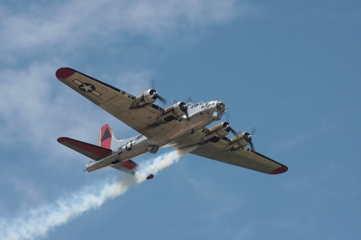 B-17G with one engine smoking