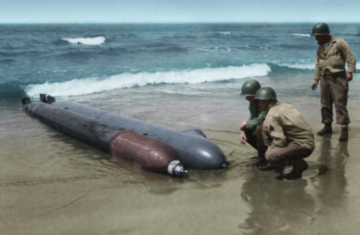 US Army troops examine a one-man submarine that washed up on Anzio beachhead in Italy. Paul Reynolds / mediadrumworld.com