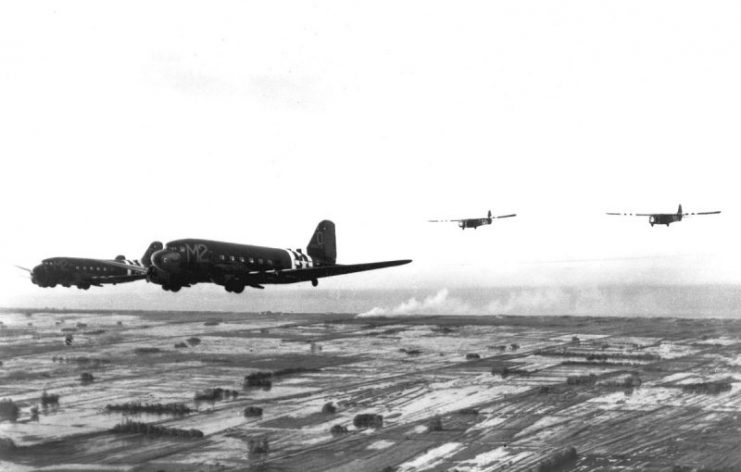 US Army Air Forces Douglas C-47A Skytrains towing Waco CG-4A gliders during the invasion of France in June 1944. On 6 June 1944, the squadron dropped the 101st Airborne Division’s 502d Parachute Infantry Regiment soon after midnight in the area northwest of Carentan, France. Glider-borne reinforcement missions followed, carrying weapons, ammunition, rations, and other supplies.