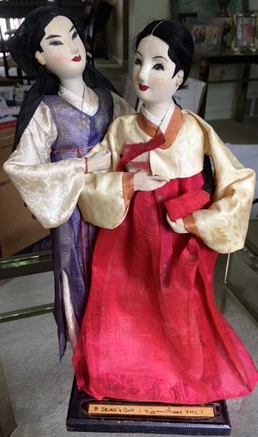 Si-yun’s wife, who had stayed in Korea during her husband’s stint at TBS, sent two handmade dolls, decorated in traditional Korean dresses, called “hanboks,” as a wedding gift. Photo courtesy of Bud Ford