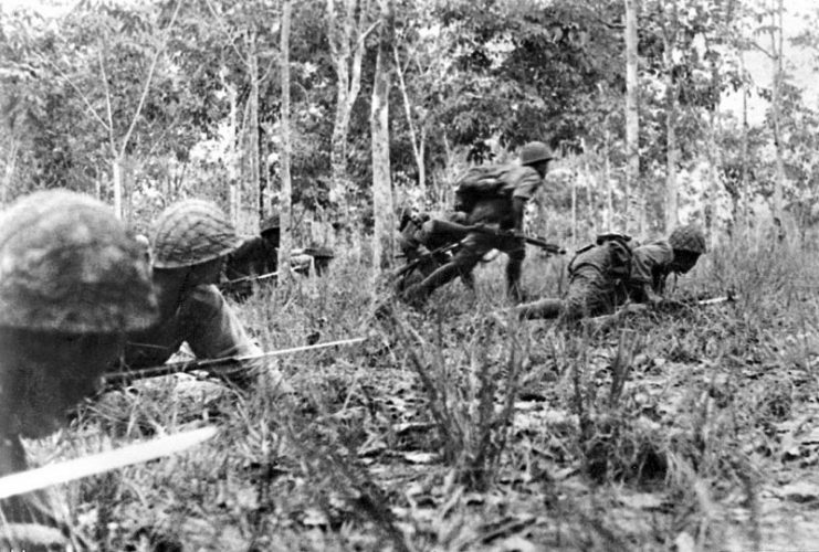 Soldiers of the Imperial Japanese Army advance during Operation U-Go, March 1944, near Manipur and the Naga Hills.