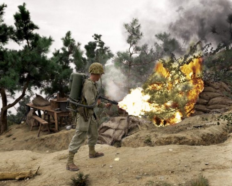 Side profile of an army soldier using a flame thrower, Korea. Paul Reynolds / mediadrumworld.com