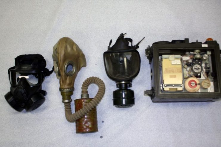 On loan from the U.S. Army Chemical Corps Museum – left to right – U.S. Model 50 mask, Russian mask recoverd in Vietnam, Iraqi mask, U.S. E41 automatic agent detector and alarm. Photo credits: National WWI Museum and Memorial