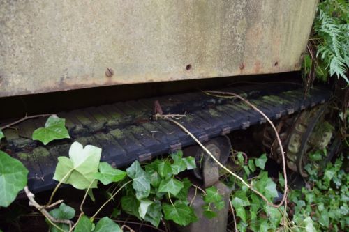 Early halftracks had a fixed adjustable idler wheel, but this was often damaged when traveling over rough terrain