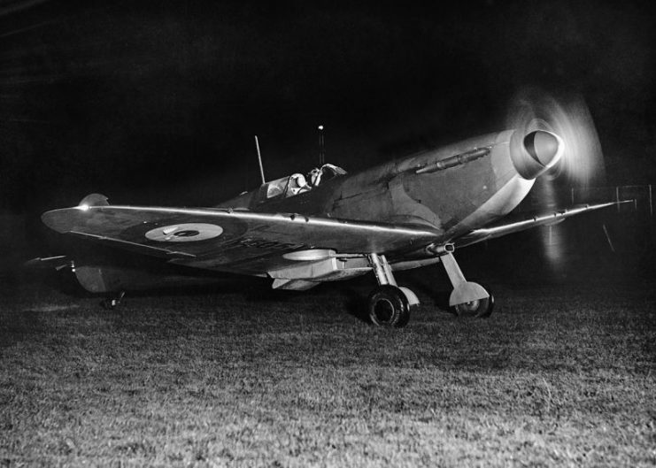 A Spitfire running up its engine prior to taking off on a night interception sortie, September 1940.