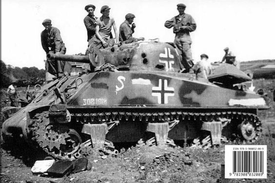 A Panzerkampfwagen M4 748 (a) Sherman recaptured by British forces after taking quite a few huts to the turret.