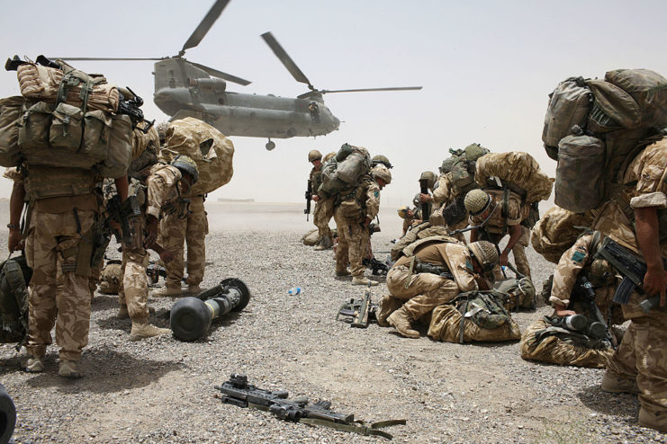 Boeing CH-47 Chinook hovering over members of the 3rd Battalion, Parachute Regiment