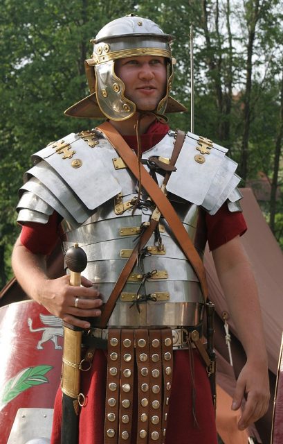Historical re-enactor wearing replica equipment of a Roman legionary about AD 75, standing in front of his contubernia’s tent. Photo: Medium69 / CC BY-SA 3.0