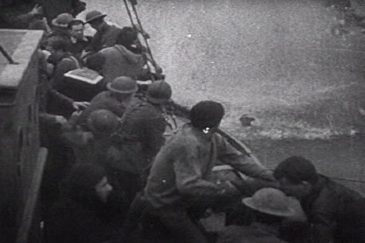 Soldiers from the British Expeditionary Force fire watching low flying German aircraft during the Dunkirk evacuation.