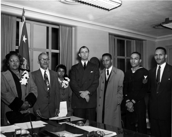 Charlton’s family meets with Secretary of the Army Frank Pace in 1952, as Charlton is recognized with the Medal of Honor.