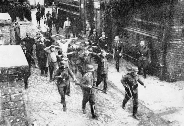 The defenders being marched off to captivity