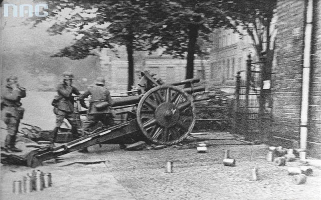 The German 105mm Howitzer seen mid recoil from a shot