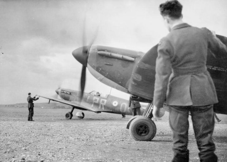 Early model Spitfires, which may date it as 1940 at RAF Northolt or Middle Wallop