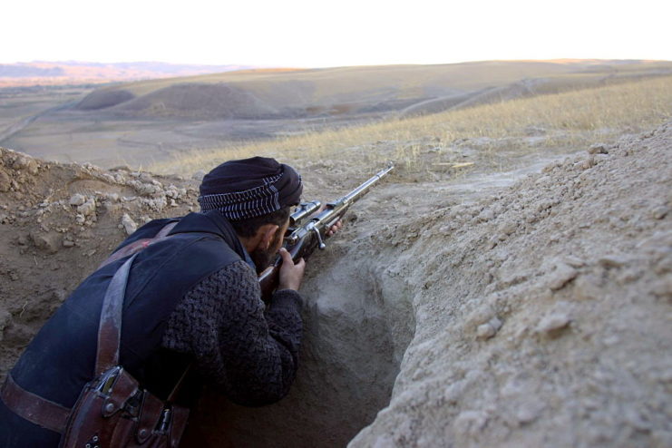 Northern Alliance sniper aiming his rifle