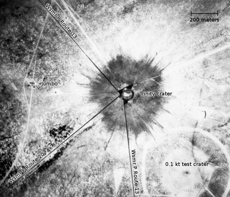 An aerial photograph of the Trinity crater just after the blast