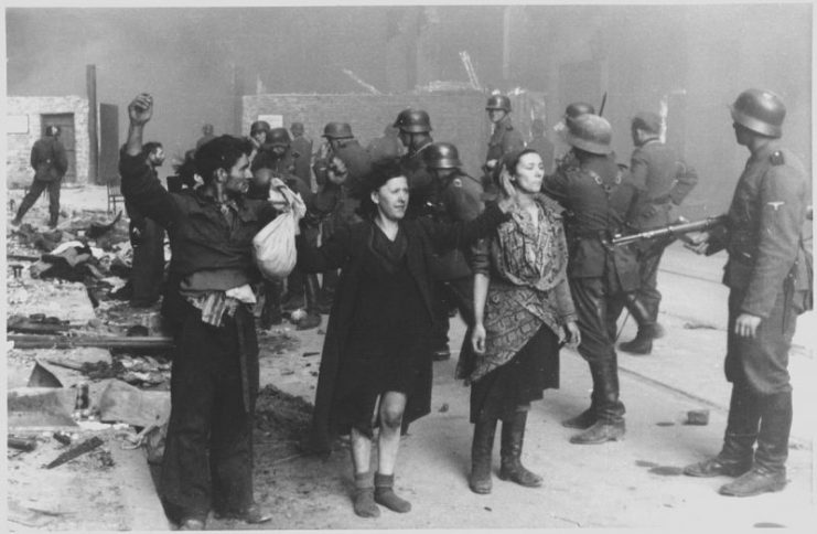German soldiers and surrendering Jews during the Warsaw Ghetto uprising.