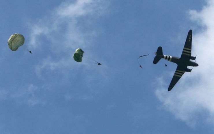 C-47 Dakota dropping parachuters.