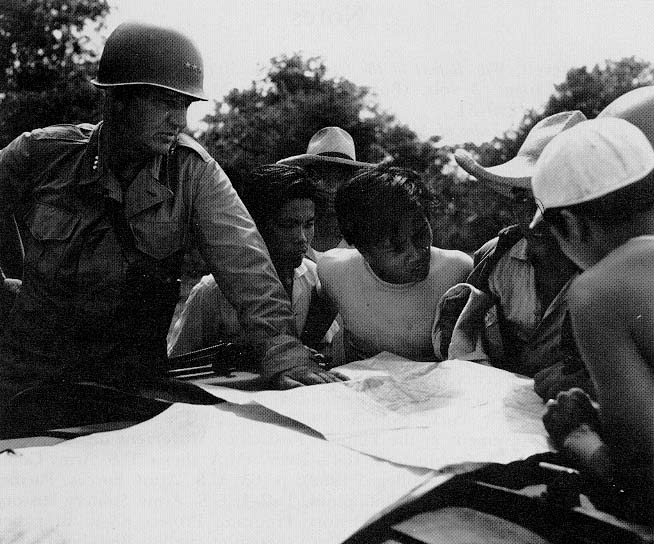 Photo: Lt. Gen. Robert L. Eichelberger, left, commanding general of the Eighth U.S. Army, and Filipino guerrillas near Manila (U.S. Army photograph)