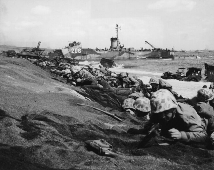 Soldiers laying on the beaches of Iwo Jima.