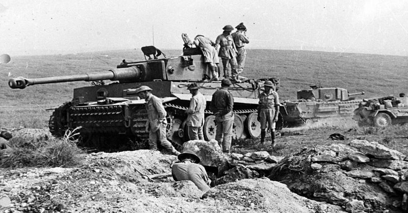 Tiger 131 in the desert being examined by British troops after its capture