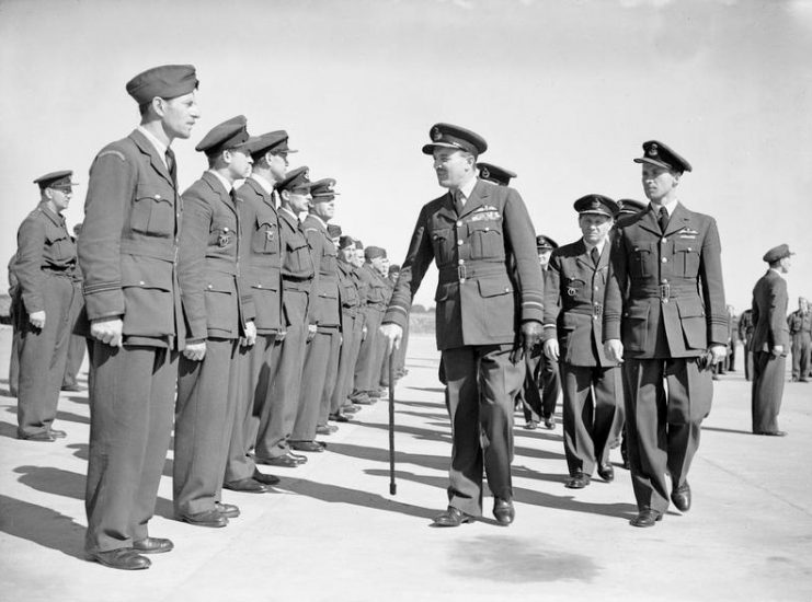 Farewell parade of Czechoslovak squadrons at RAF Manston, Kent, on 3 August 1945. Air Marshal John Slessor, with walking stick, inspects some of the men. Air Marshal Karel Janoušek can be seen behind him.