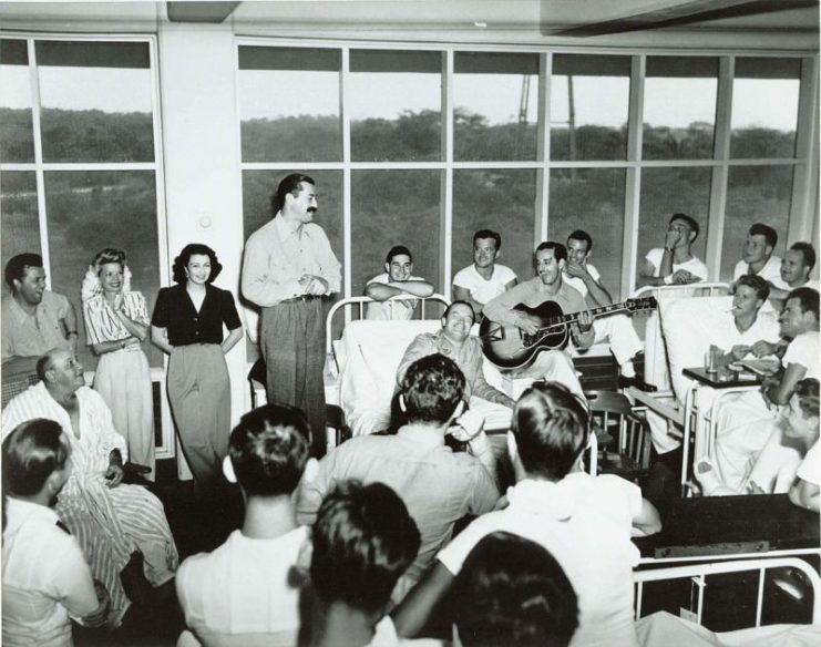 Entertainers Bob Hope and Francis Langford entertaining patients at the Coco Solo Hospital, Panama Canal Zone, 1944.