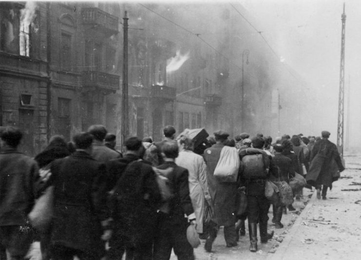 Jews captured during the Warsaw Ghetto Uprising are marched to the Umschlagplatz for deportation.