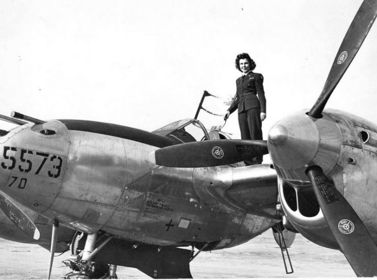 WASP pilot Dorothy Olsen on the wing of a P-38L Lightning, 1945.