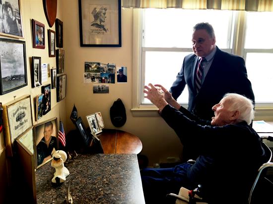 Kelly explaining details of the events to Congressman Smith.