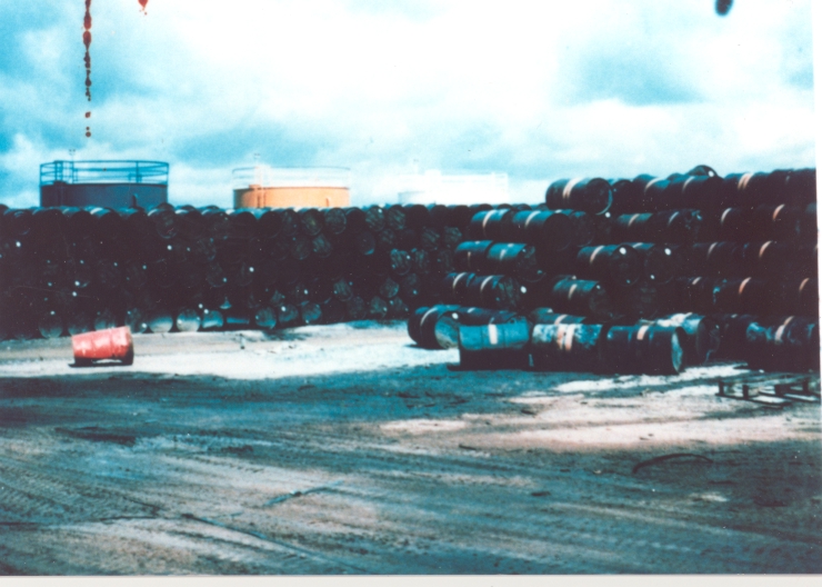 Stacks of 55 gallon drums containing Agent Orange