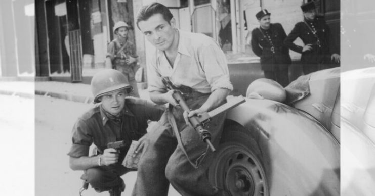 Staged photo of an American officer and a French partisan, France 1944.