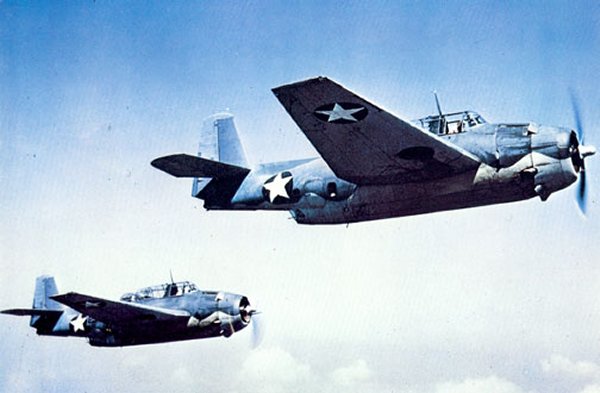 Two U.S. Navy Grumman TBF-1 Avenger torpedo bombers in flight, circa 1942.