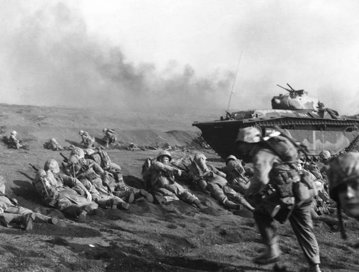 Marines wait to move inland, Iwo Jima 1945.