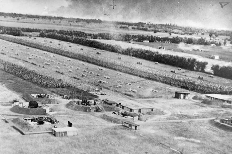 A radar directed flak battery awaits B-24s in the distance. German and Romanian defenders found the low-flying Liberators easy targets.