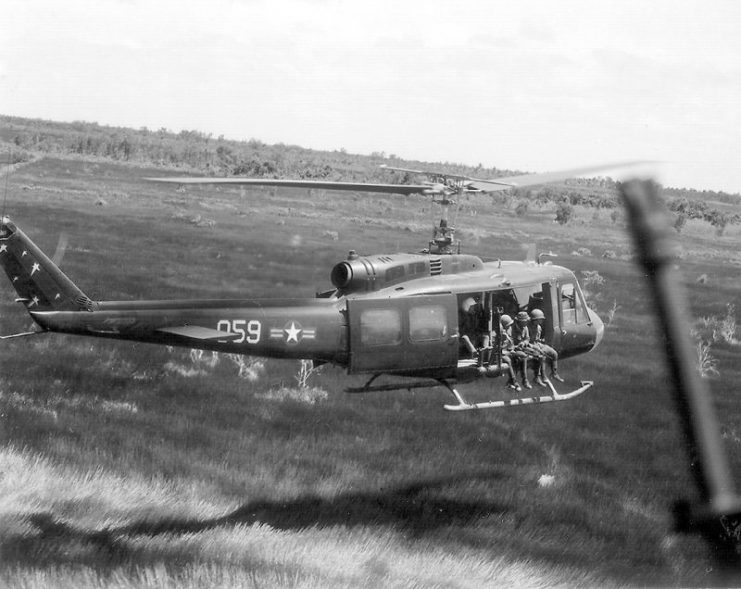 A Vietnam Air Force crew from the 211th Helicopter Squadron fly on a combat assault mission July 18, 1970, in a UH-1 Helicopter.