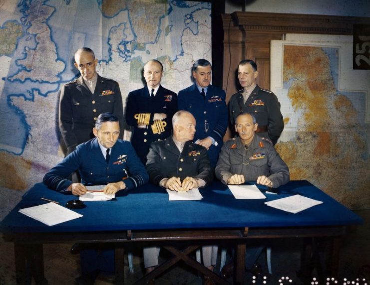 Meeting of the Supreme Headquarters Allied Expeditionary Force (SHAEF), 1 February 1944. Front row: Air Chief Marshal Arthur Tedder; General Dwight D. Eisenhower; General Bernard Montgomery. Back row: Lieutenant General Omar Bradley; Admiral Bertram Ramsay; Air Chief Marshal Trafford Leigh-Mallory; Lieutenant General Walter Bedell Smith.