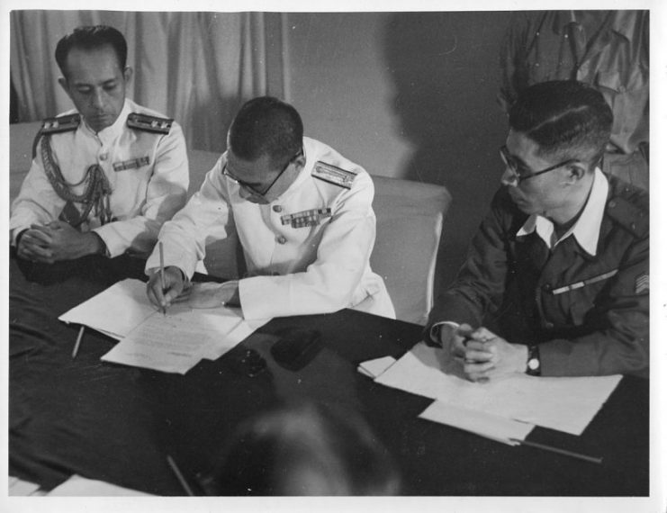 Japanese Navy officer signing the surrender of Penang aboard HMS Nelson on September 2, 1945. Penang was liberated by the Royal Marines on the following day under Operation Jurist.