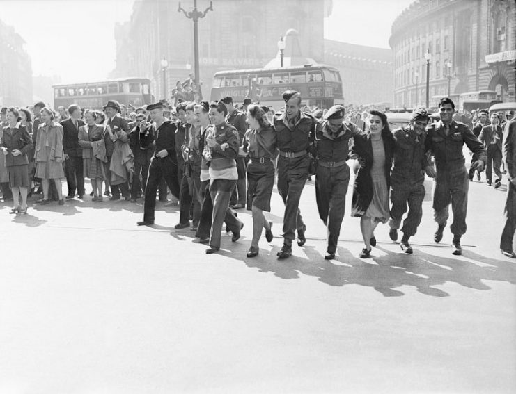 Civilians and service personnel in London celebrating V-J Day on 15 August 1945