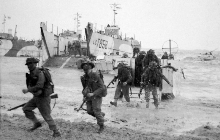 British Army coming ashore from Landing Craft Infantry at Gold Beach near La Rivière-Saint-Sauveur, Normandy, France, on 6 June 1944