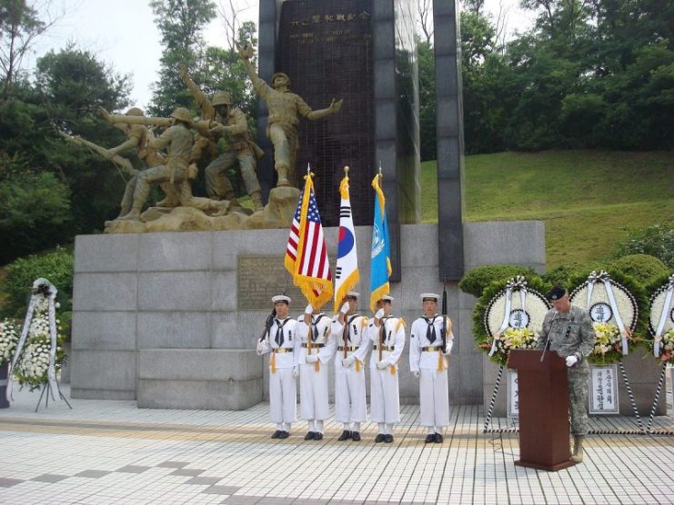 South Korean sailors in formation in front of the Task Force Smith memorial at Osan