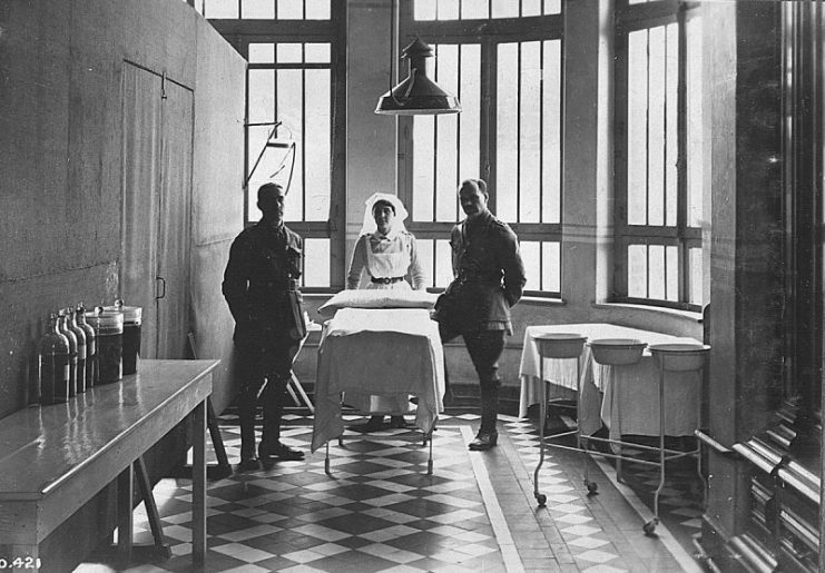 Two soldiers and a nurse, presumably serving with the Canadian Expeditionary Force, during the First World War.