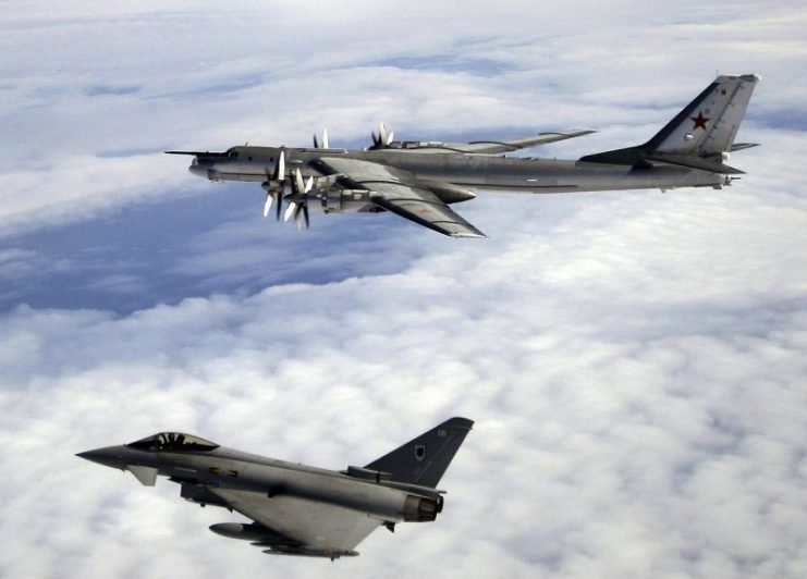 A Tu-95 escorted by an RAF Typhoon.