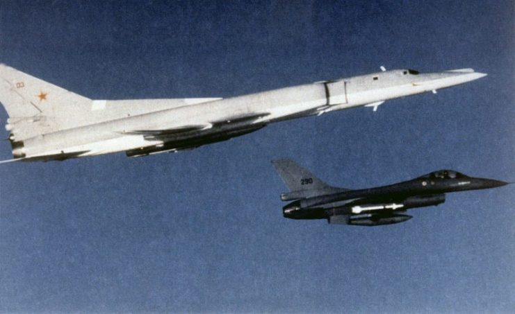 A Royal Norwegian Air Force General Dynamics F-16A Fighting Falcon aircraft escorting a Soviet Tupolev Tu-22M bomber.