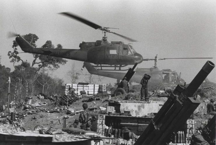 Marine UH-1E (Huey) helicopters touch down with their loads at Fire Support Base Cunningham.