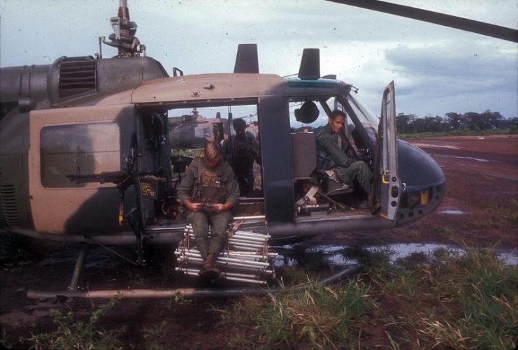 The crew of a U.S. Air Force UH-1P Huey from the 20th Special Operations Squadron Green Hornets armed and ready for a covert mission. Notice the flexible ladder that could be extended to pick up personnel when the helicopter could not land.