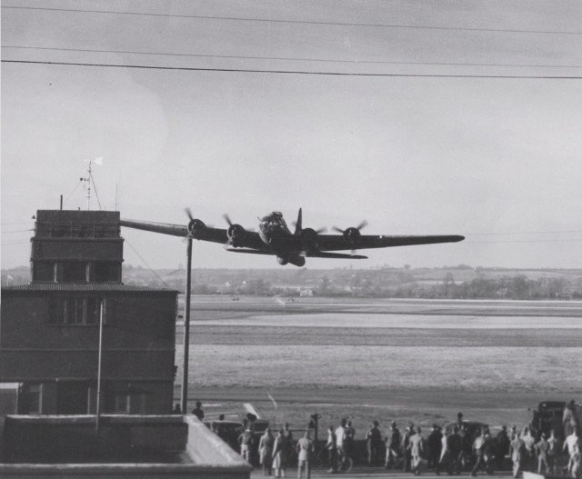 B-17F Fortress aircraft of the 91st BG, 8th Air Force executing a low fly-over during a demonstration at Bassingbourn, England, United Kingdom, 1943