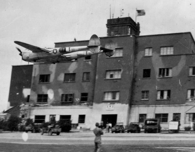 P-38 buzzing an airfield