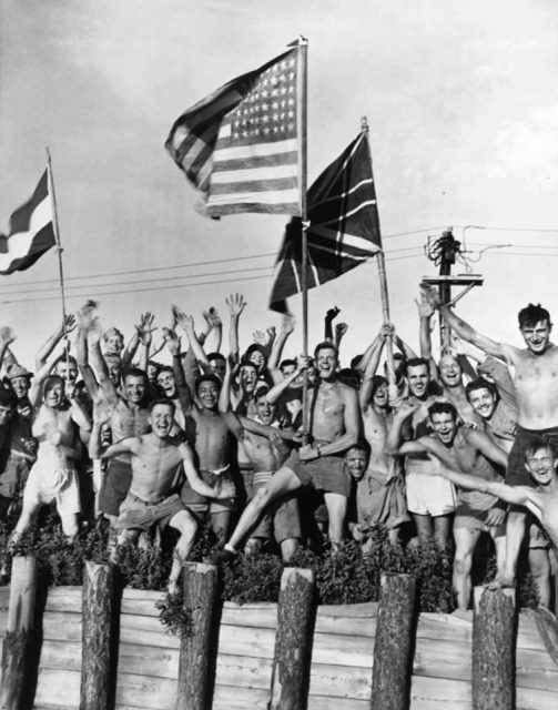 Allied prisoners of war at Aomori camp near Yokohama cheered as US Navy and other Allied personnel arrived to rescue them, 29 August 1945.